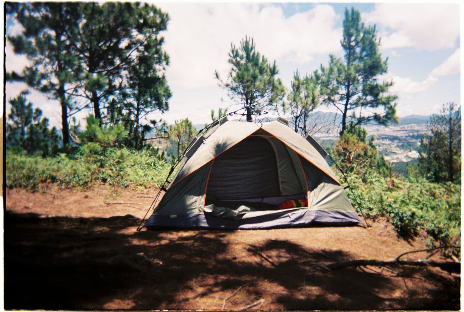 Tent set up at a campsite among trees